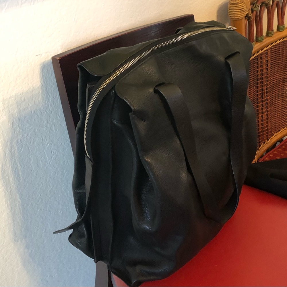 Bespoke black leather travel bag. Fits under seat on airplane.